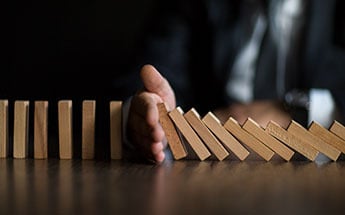 Hand holding dominoes