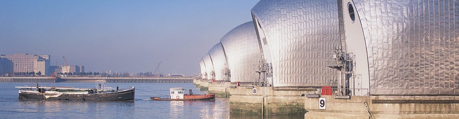 Thames Barrier on calm River Thames with blue sky in winter, London