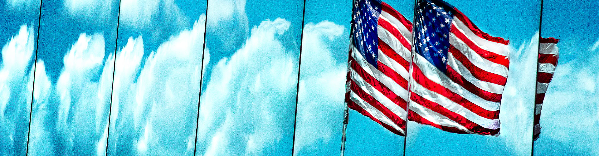 American flag against background of clouds